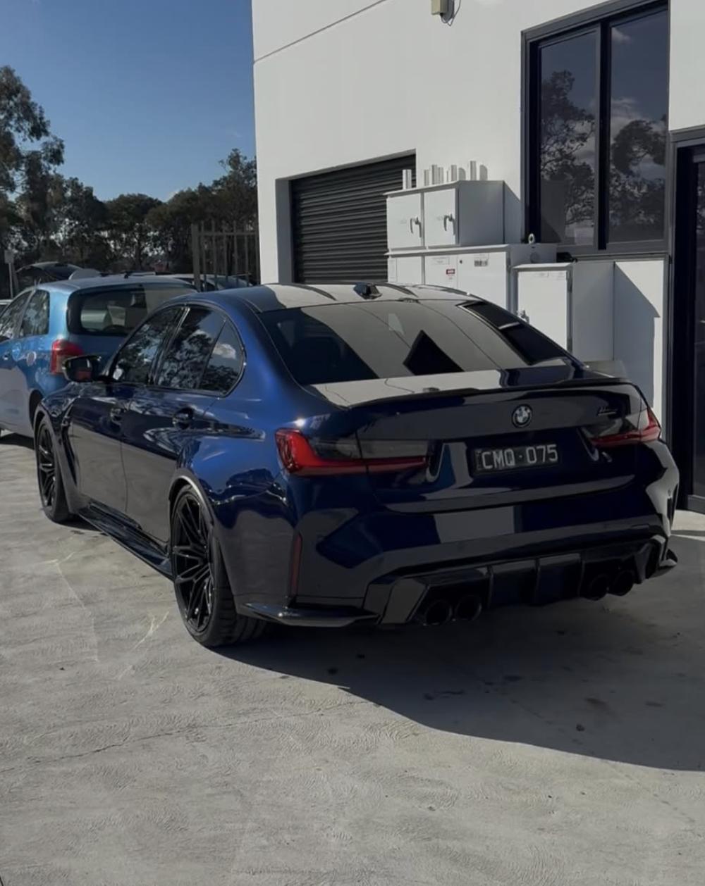 Dark car with deep reflective gloss after ceramic coating cure