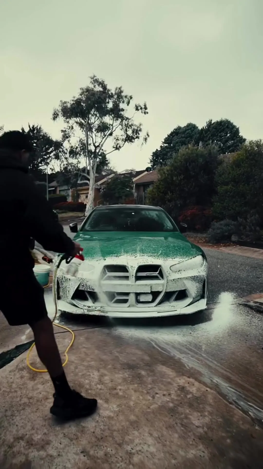 Green BMW M4 mid full detail: snow foam, wash mitt, rinse and towel dry